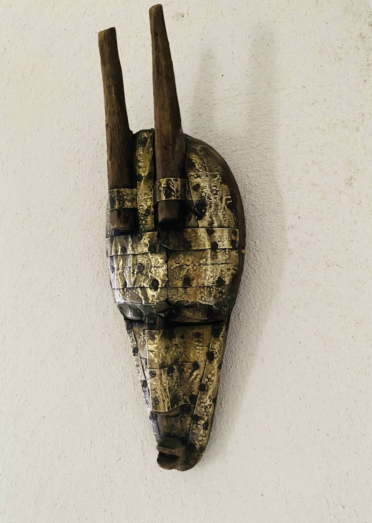 Ancient wooden and brass mask