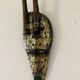 Ancient wooden and brass mask