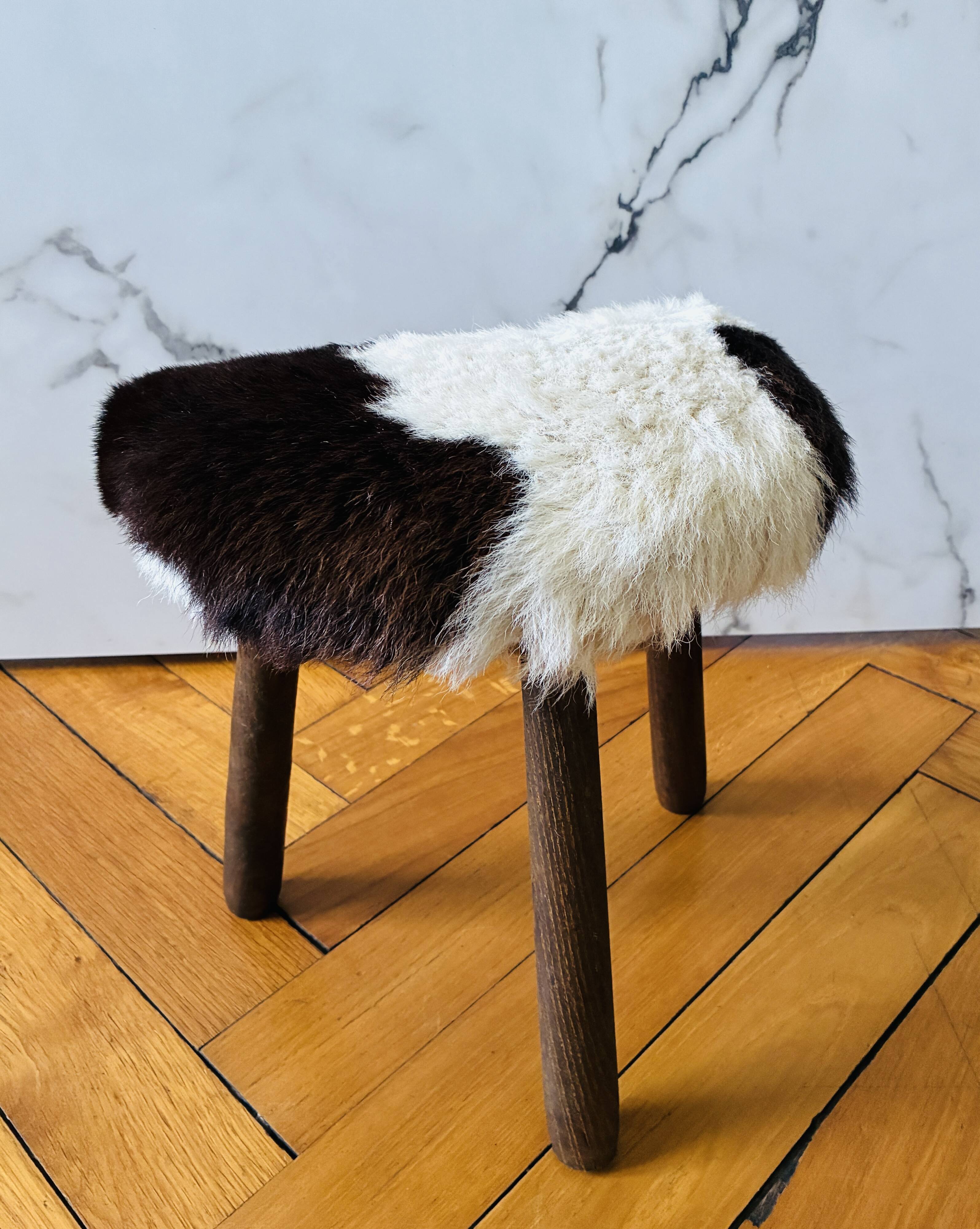 Small tripod stool in cowhide