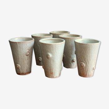 6 cups in glazed sandstone relief wood
