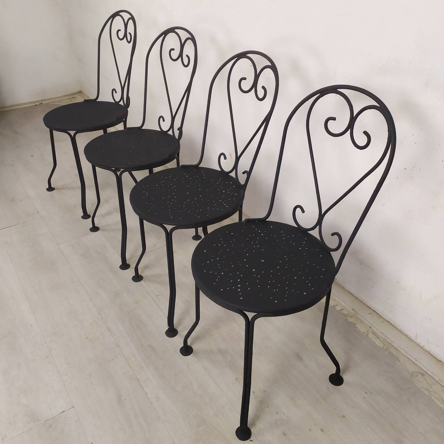 4 black garden chairs