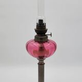 Old metal and pink glass oil lamp