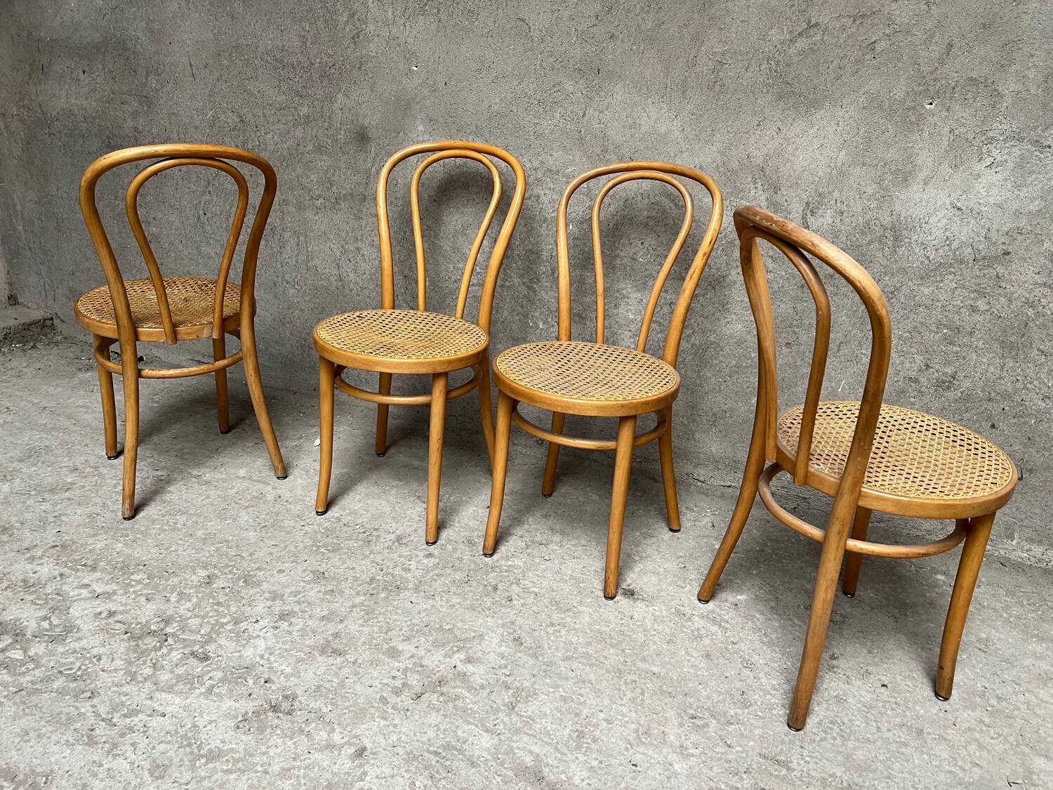 Set of 4 vintage bistro chairs in curved wood and cane seats 1950 1960