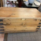 Old trunk in natural pine wood with padded interior