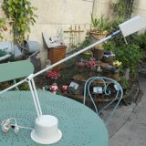 Massive swing desk lamp has two lights and a kneecap