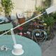 Massive swing desk lamp has two lights and a kneecap