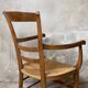 Louis Philippe armchair in walnut and straw, 19th century.