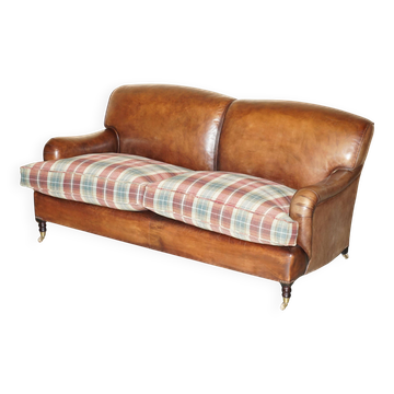 George Smith Signature Scroll leather canapé with tartan Scottish wool cushions.