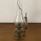 Oil lamp with glass pedestal and integrated round mirror