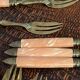 Dessert forks in brass and Bakelite in their case.