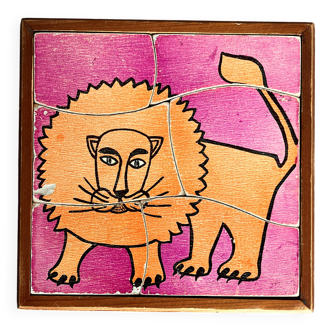 Wooden frame puzzle from the 1960s depicting a lion.