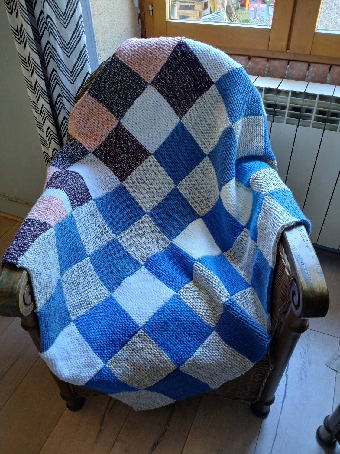 Hand knitted patchwork plaid