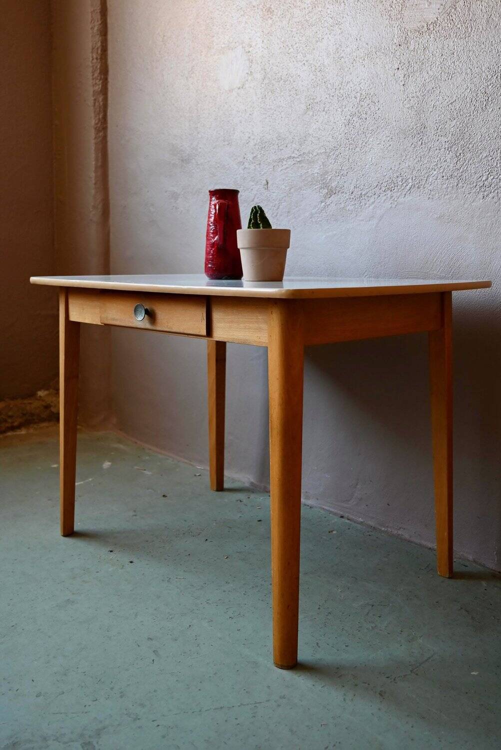 1950s Formica kitchen table with tapered legs and vintage drawer.
