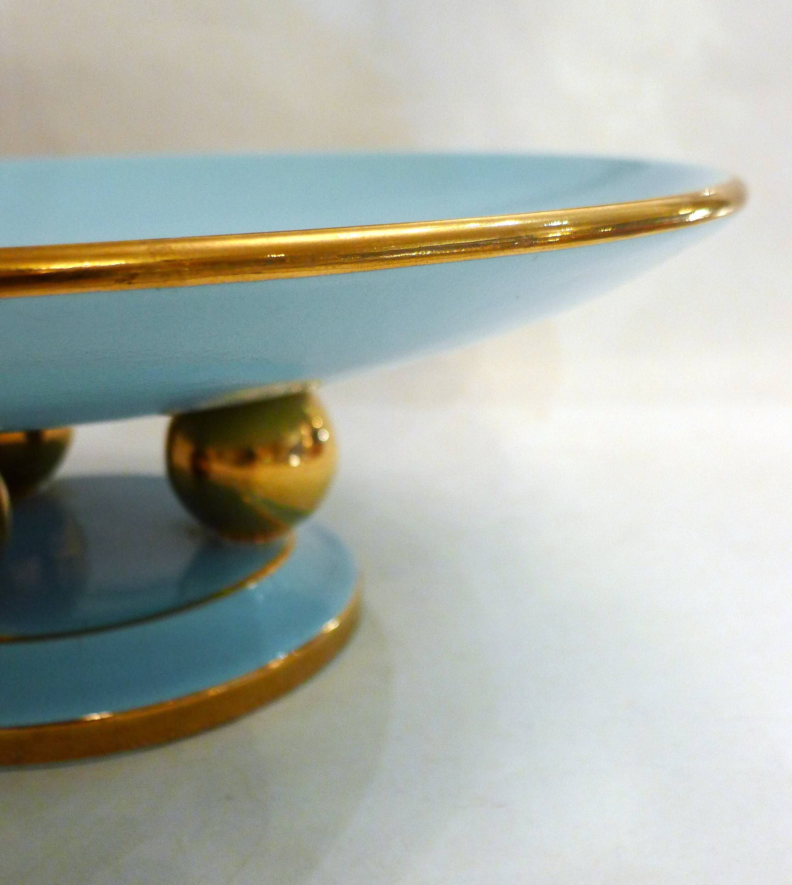 Art Deco modernist coupe, with a base of 3 spheres, in turquoise ceramic and gilding.