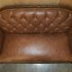 Chesterfield Regency 1810 antique canapé restored in leather with a carved frame.