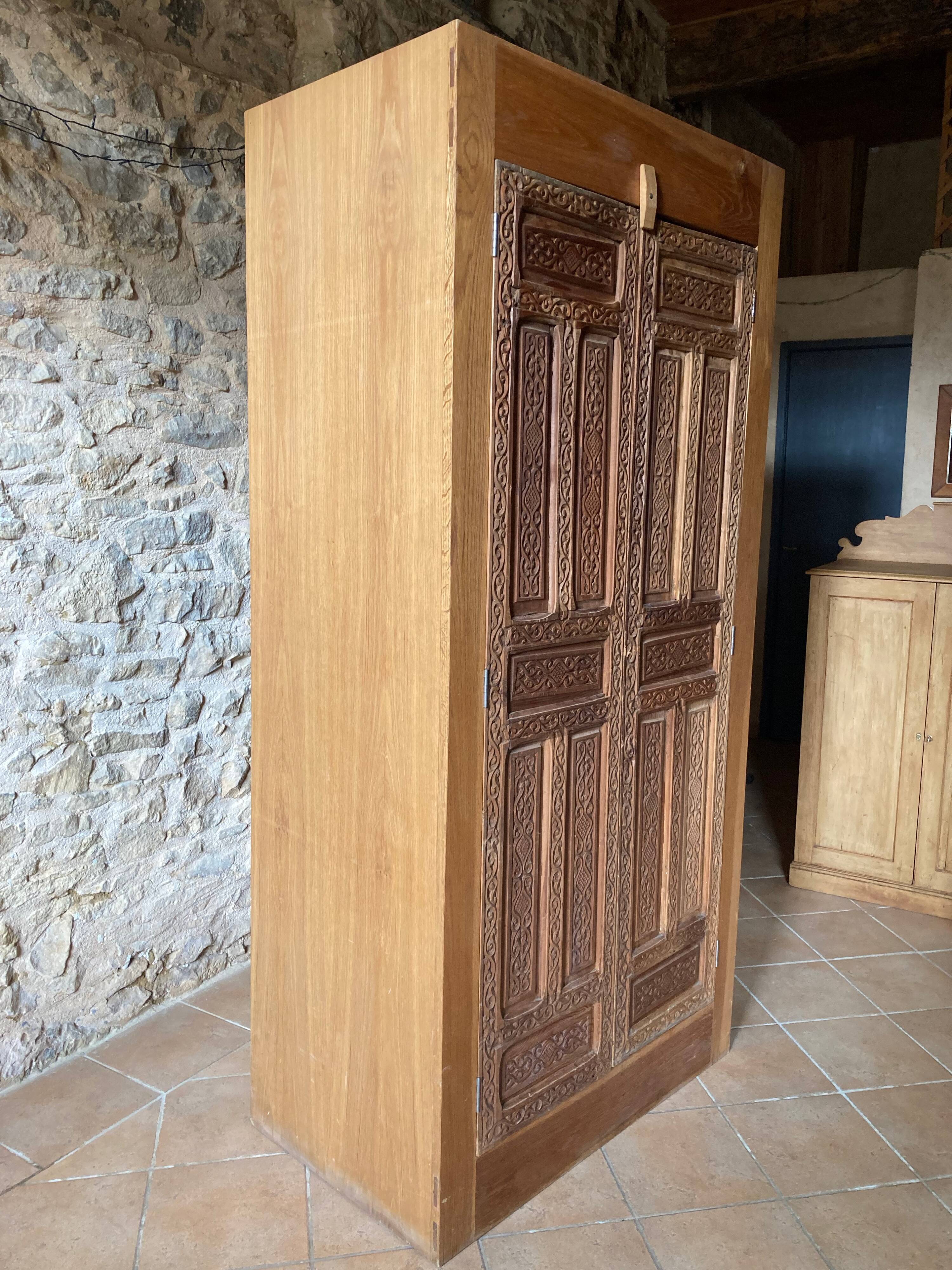 Wardrobe with exotic carved doors