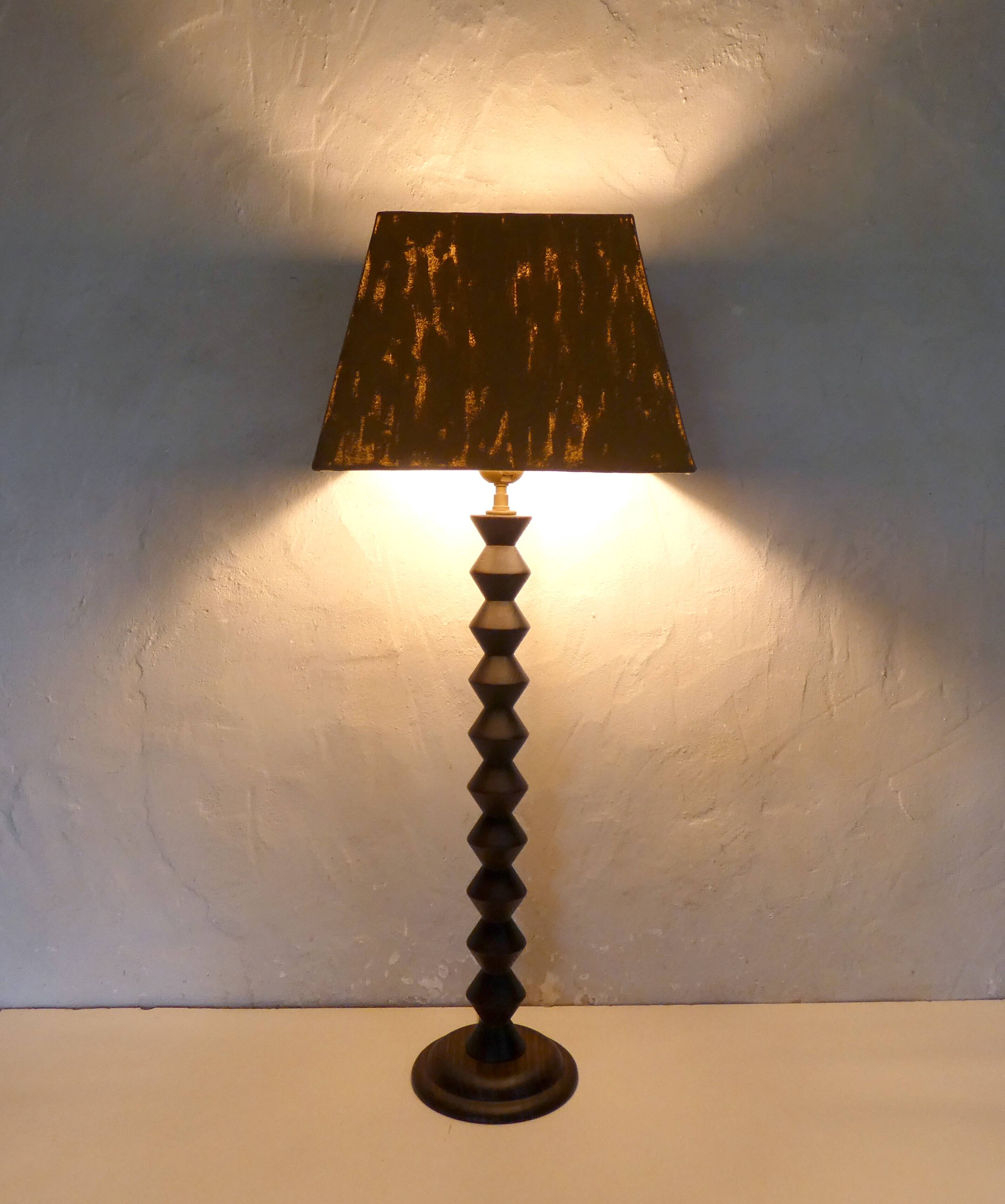 turned wooden lamp with spool base and vintage copper shade