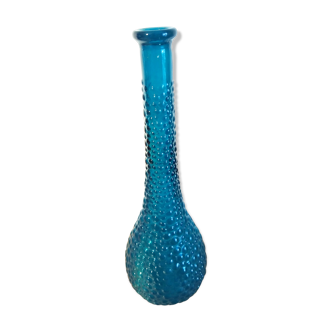 bottle made of blue vintage molded glass