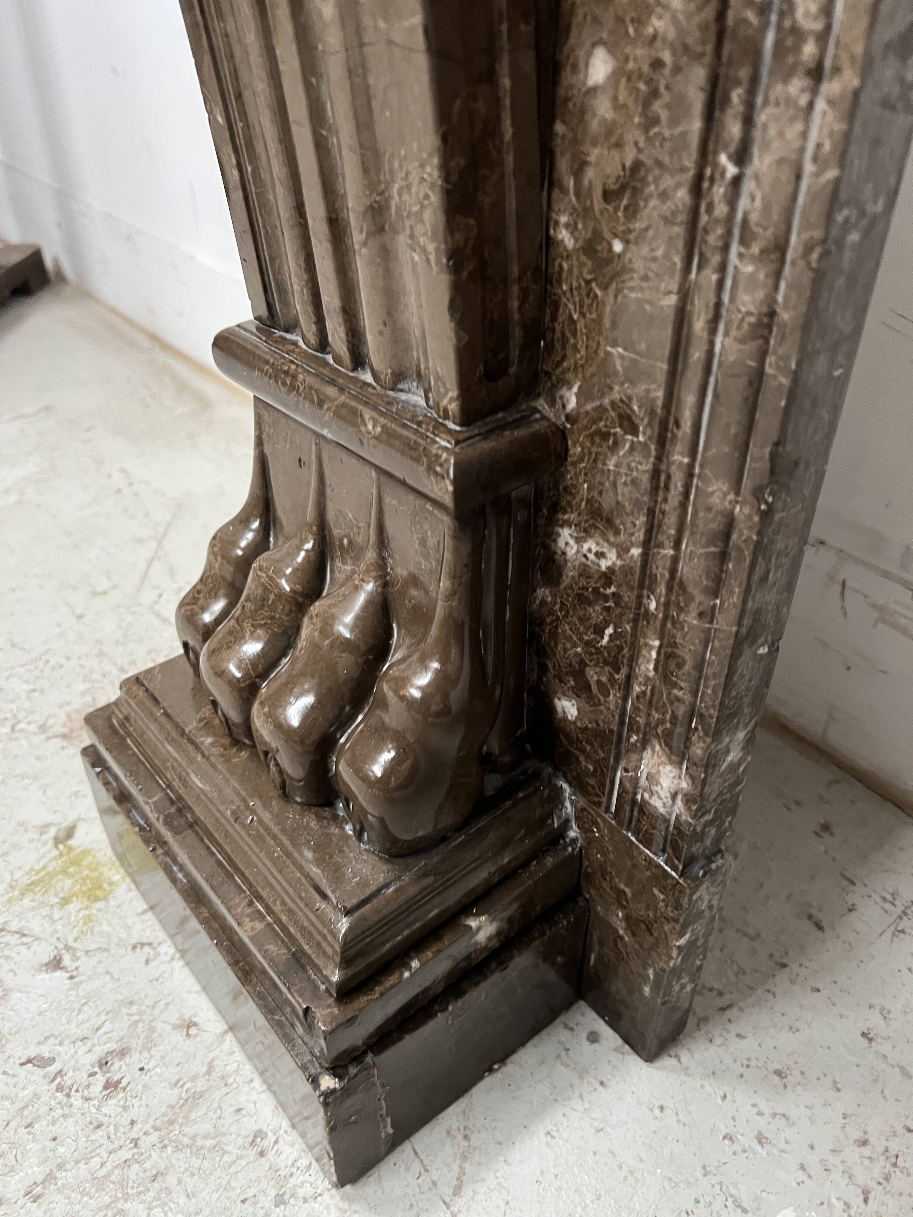 Napoleon III fireplace with claw feet in speckled marble, 19th century.