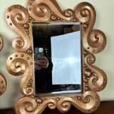 According to the model “the waves” by Jean Boggio: pair of designer gold mirrors circa 1980