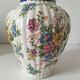 Antique vase with floral decoration in enamelled earthenware – timeless charm