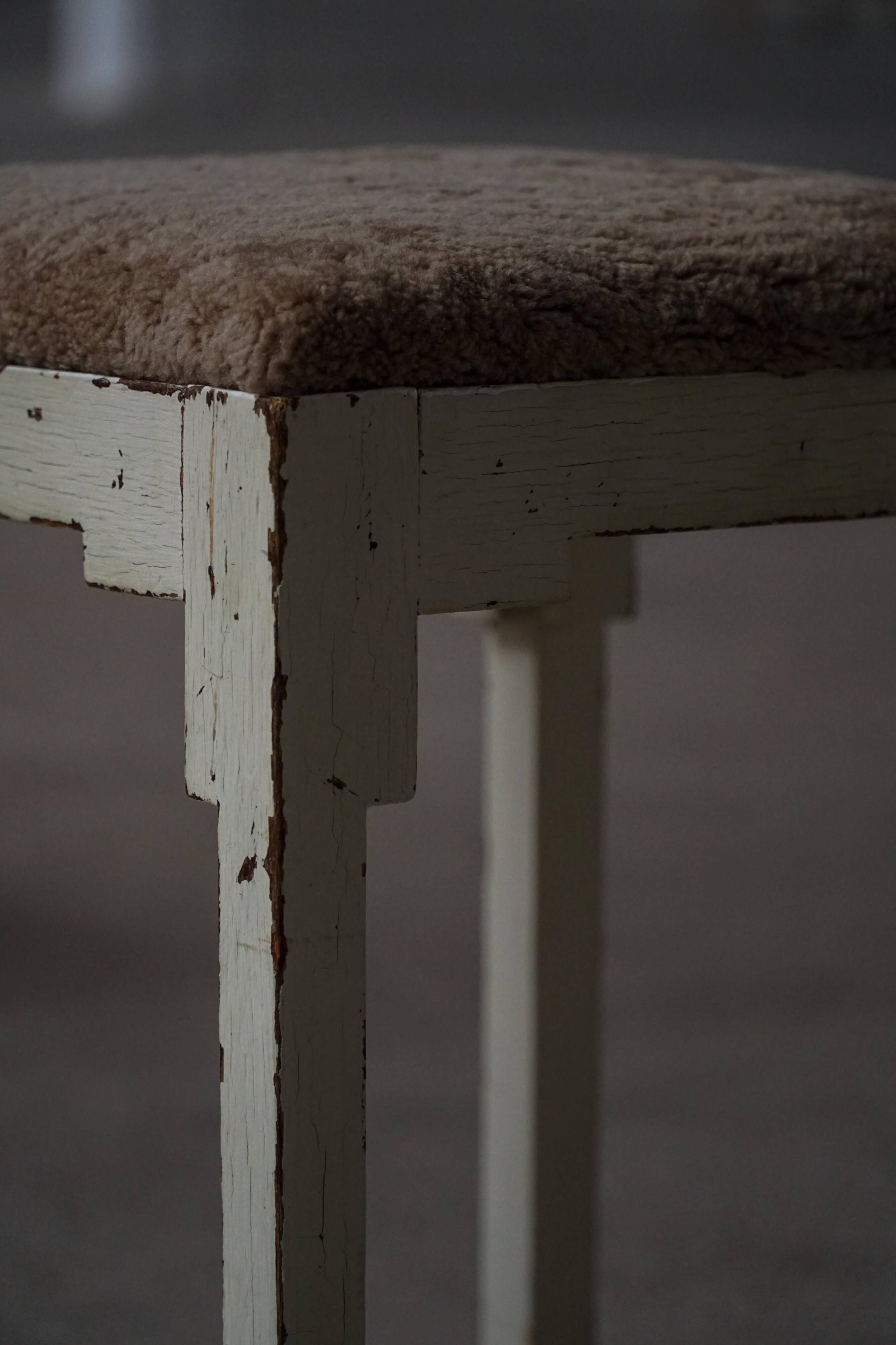 A pair of antique Danish stools, seats in lambswool, late 19th century.