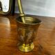 Golden brass mortar and pestle