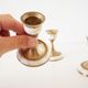 Lot of old candlesticks in brass and mother-of-pearl