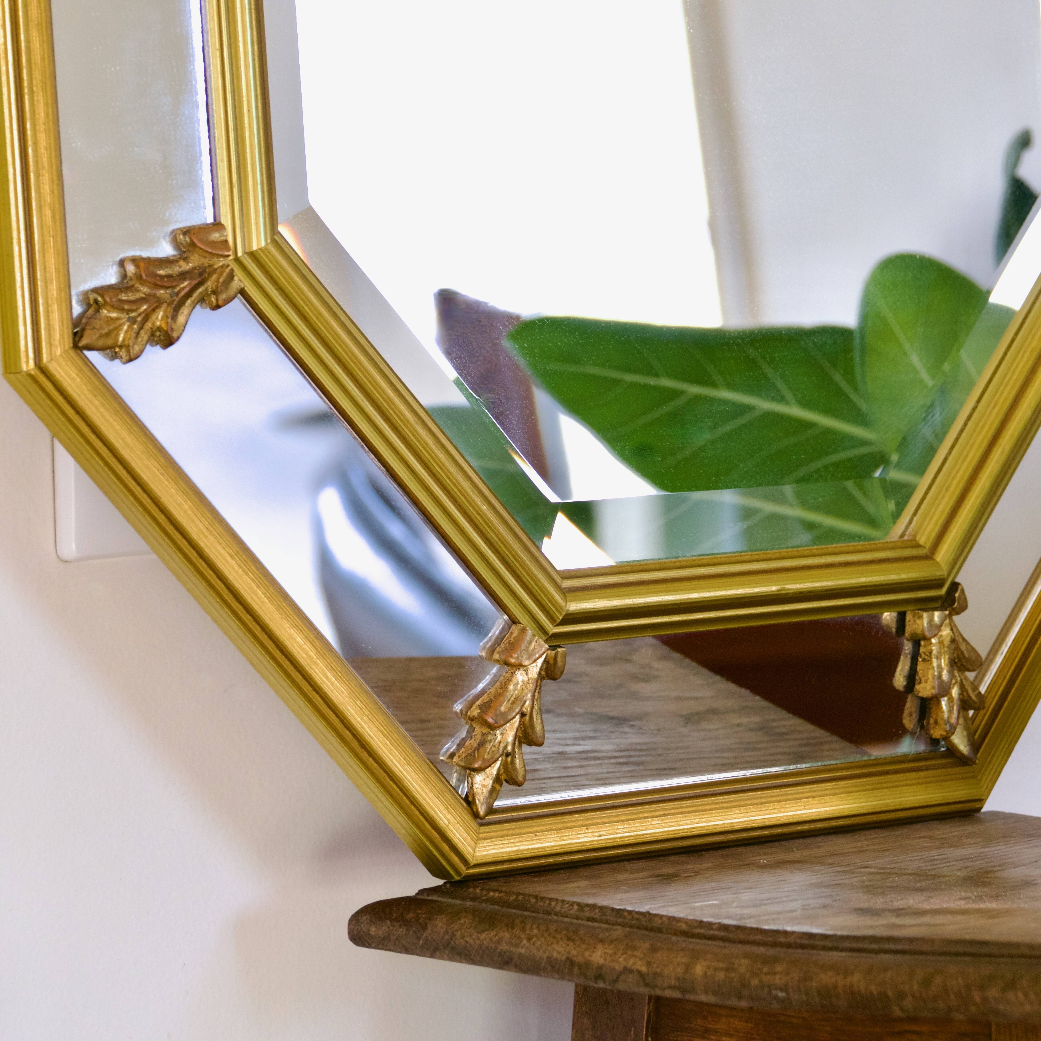 Large beveled, neoclassical mirror with gilded wood edges