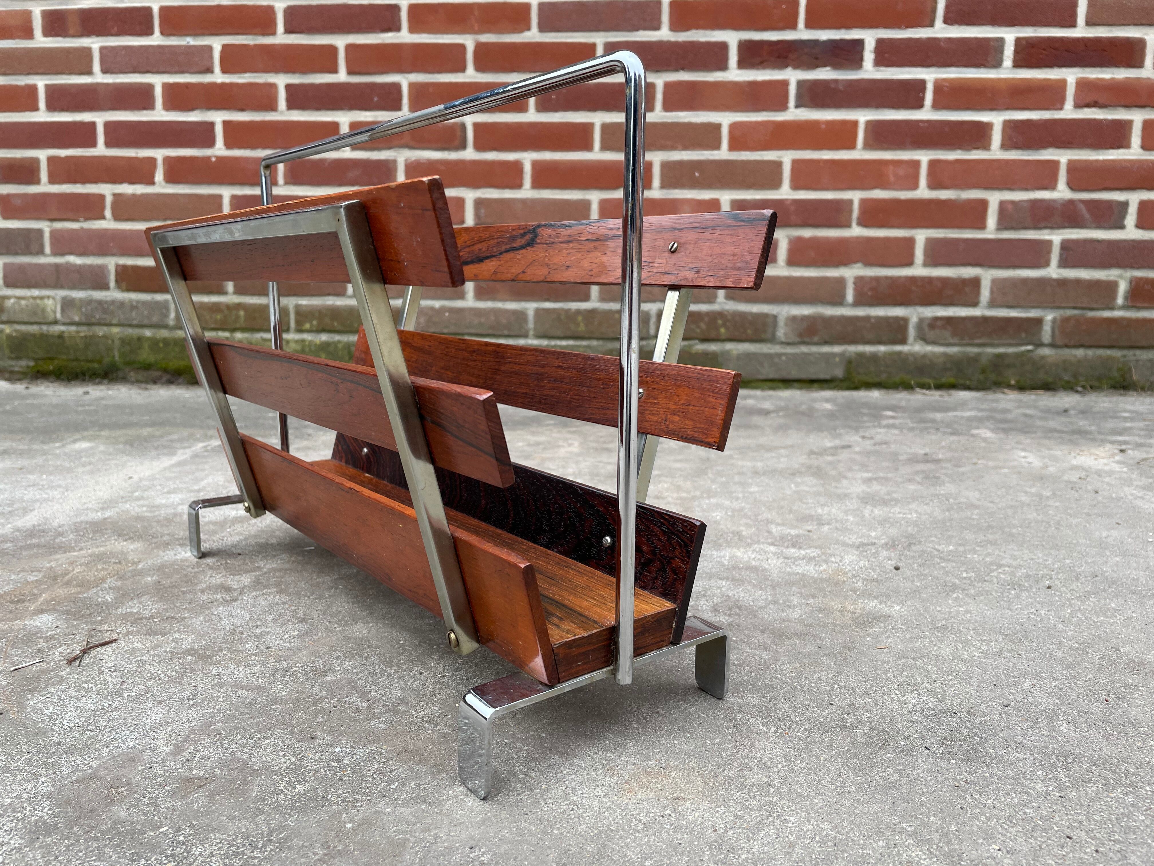 Vintage magazine rack from  rosewood and chrome design