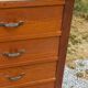 Vintage 1950s chest of drawers with tapered legs and 5 drawers.