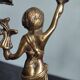 Pair of antique candlesticks in cherub bronze