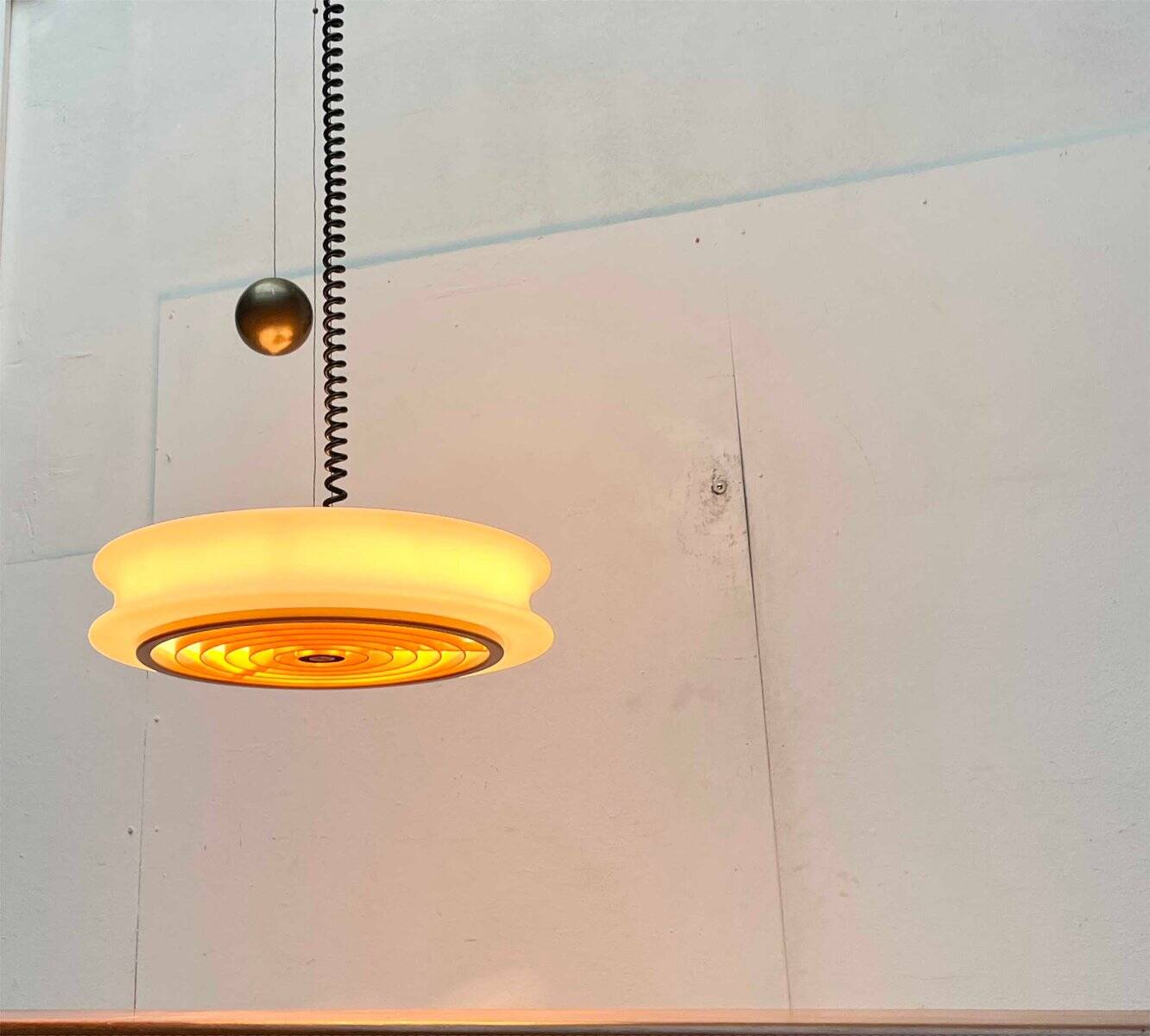 Orion counterweight pendant lamp in mid-century modern German space style, made of Staff Leuchten glass, 1960s.