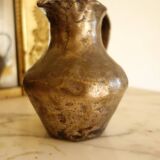 Old solid metal pitcher