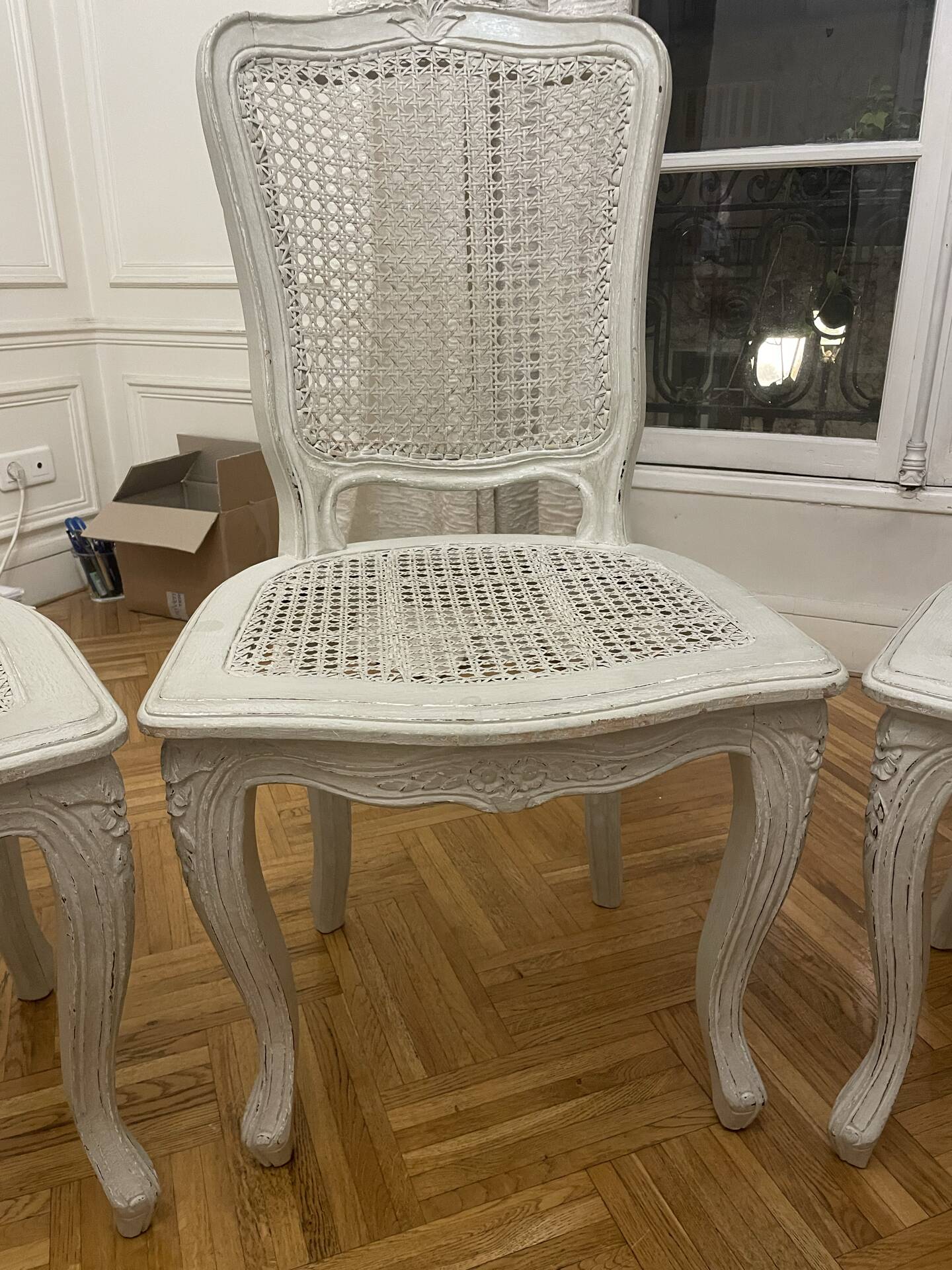 Set of 4 white caned chairs in Louis XV style.
