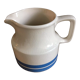 Porcelain pitcher stamped Oxford Ireland. Wide blue stripes on a white background