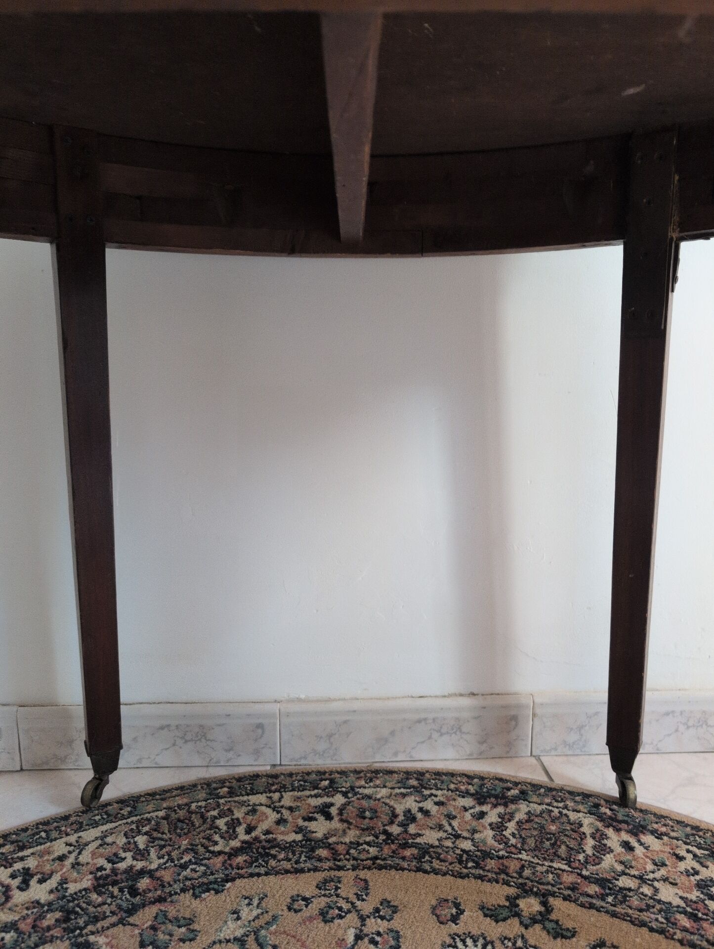 Old half-moon table or serving trolley on wheels