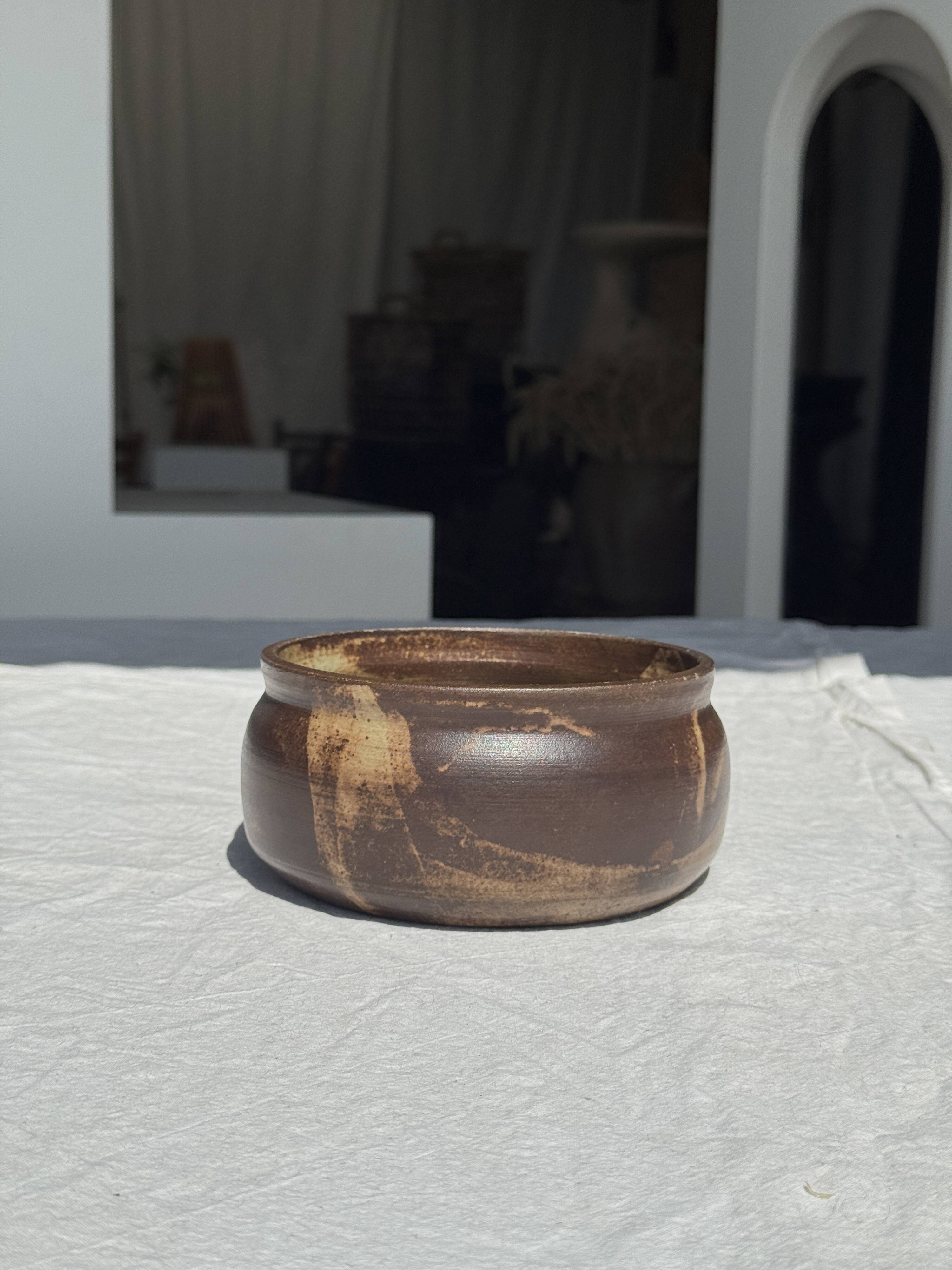 A small stoneware bowl, brown exterior, speckled grey interior D15