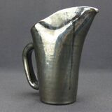 Old Biot, modernist pitcher in iridescent black ceramic.