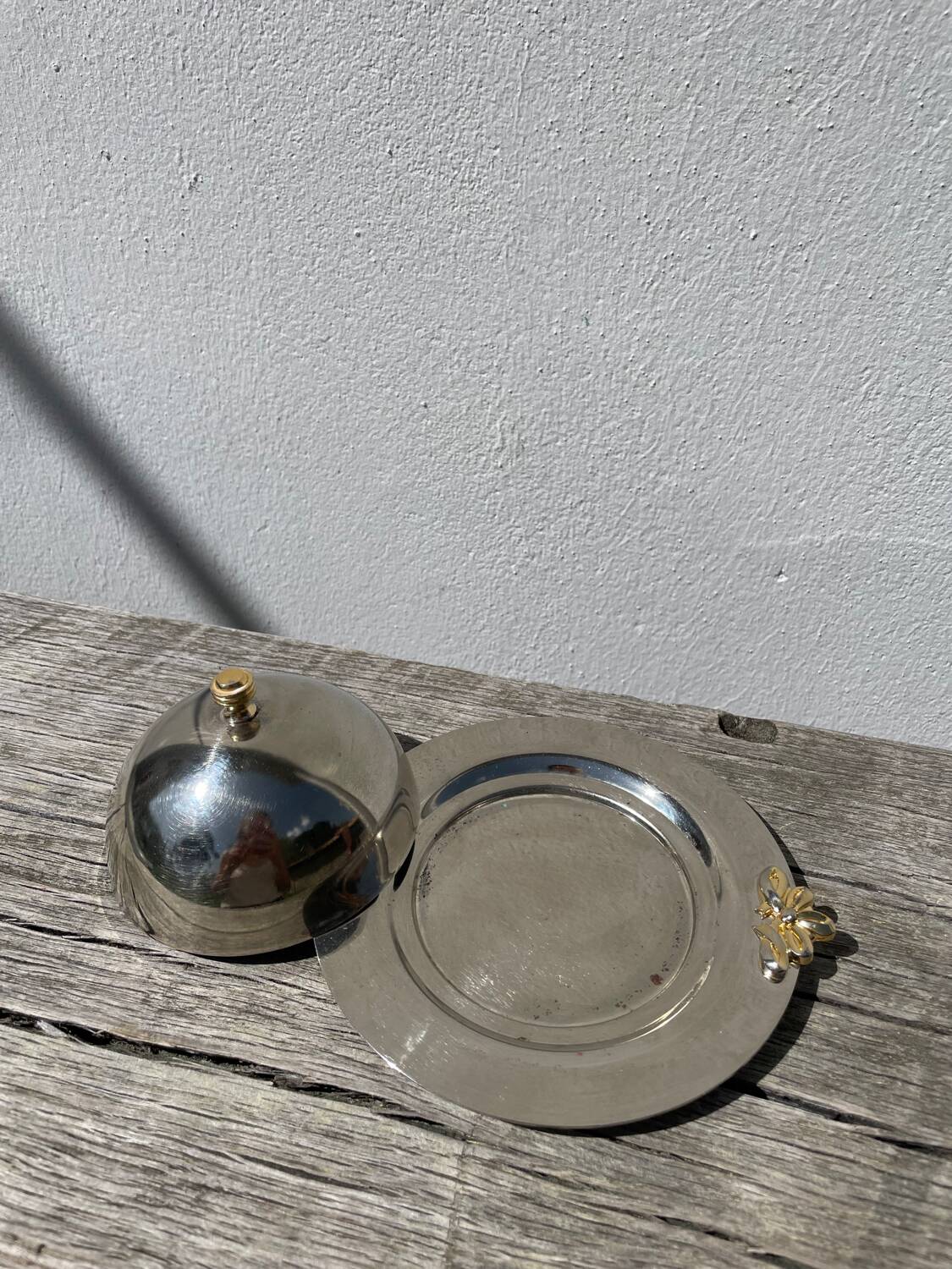 Silver-plated metal butter dish with knots