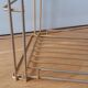 String shelf in golden metal wires