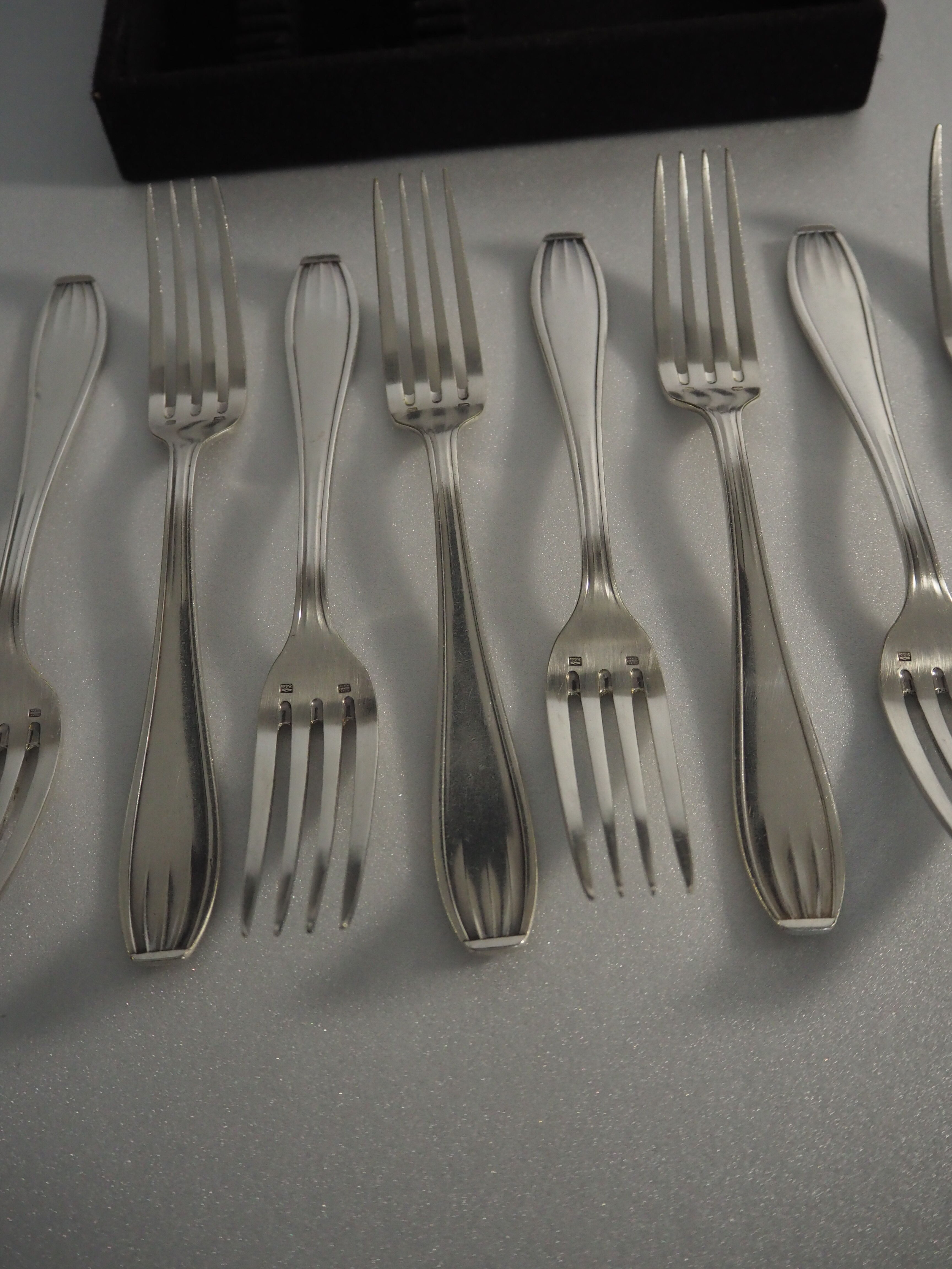 12 SFAM forks in its dark chocolate case