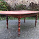 Antique cherry wood farmhouse table with rounded ends