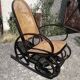 Vintage Thonet rocking chair in cane and bent wood.