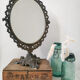 Old mirror on foot metal 30x46cm