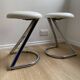 Pair of vintage Z low stools with chrome metal base and white skai seat. H: 49 cm 80s
