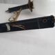 Empire style torch wall sconce