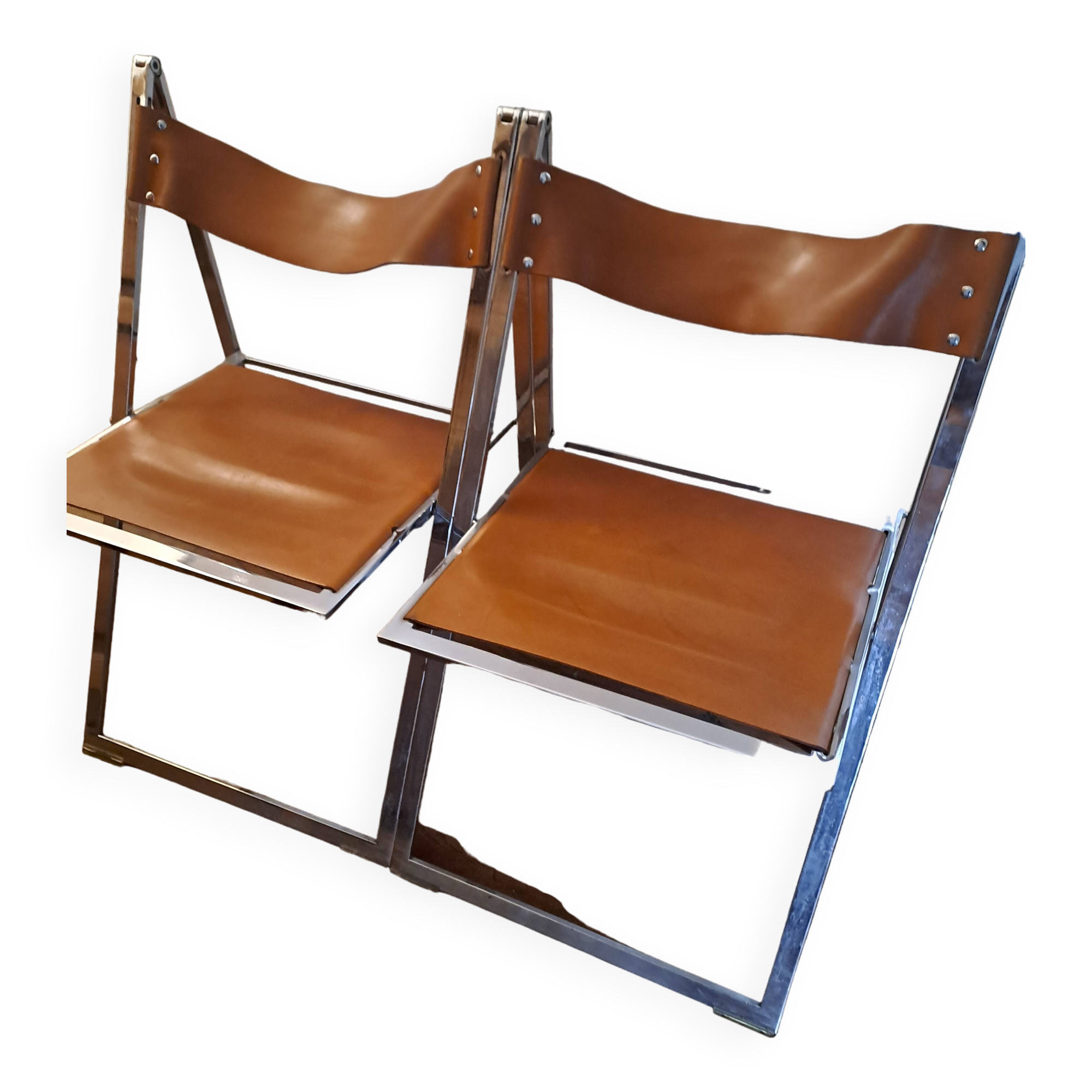 2 Chromed metal and leather folding chairs. 70s. Fontoni & Geraci