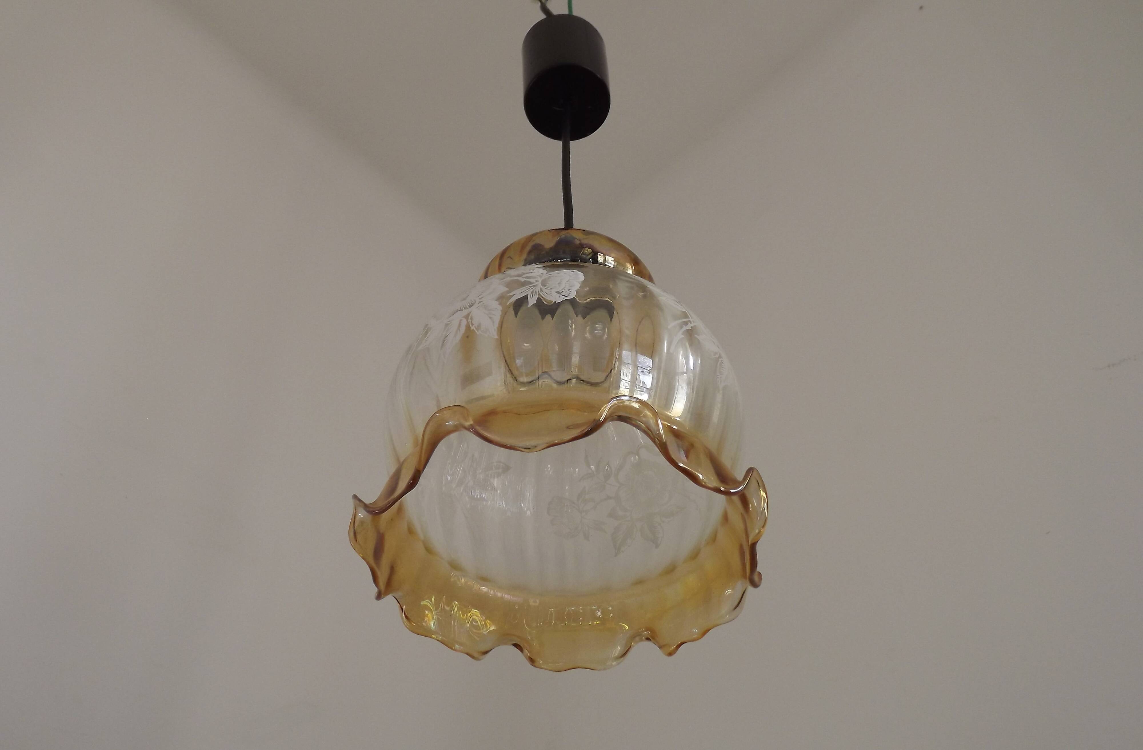 French vintage amber and clear glass ceiling light with white floral decoration.