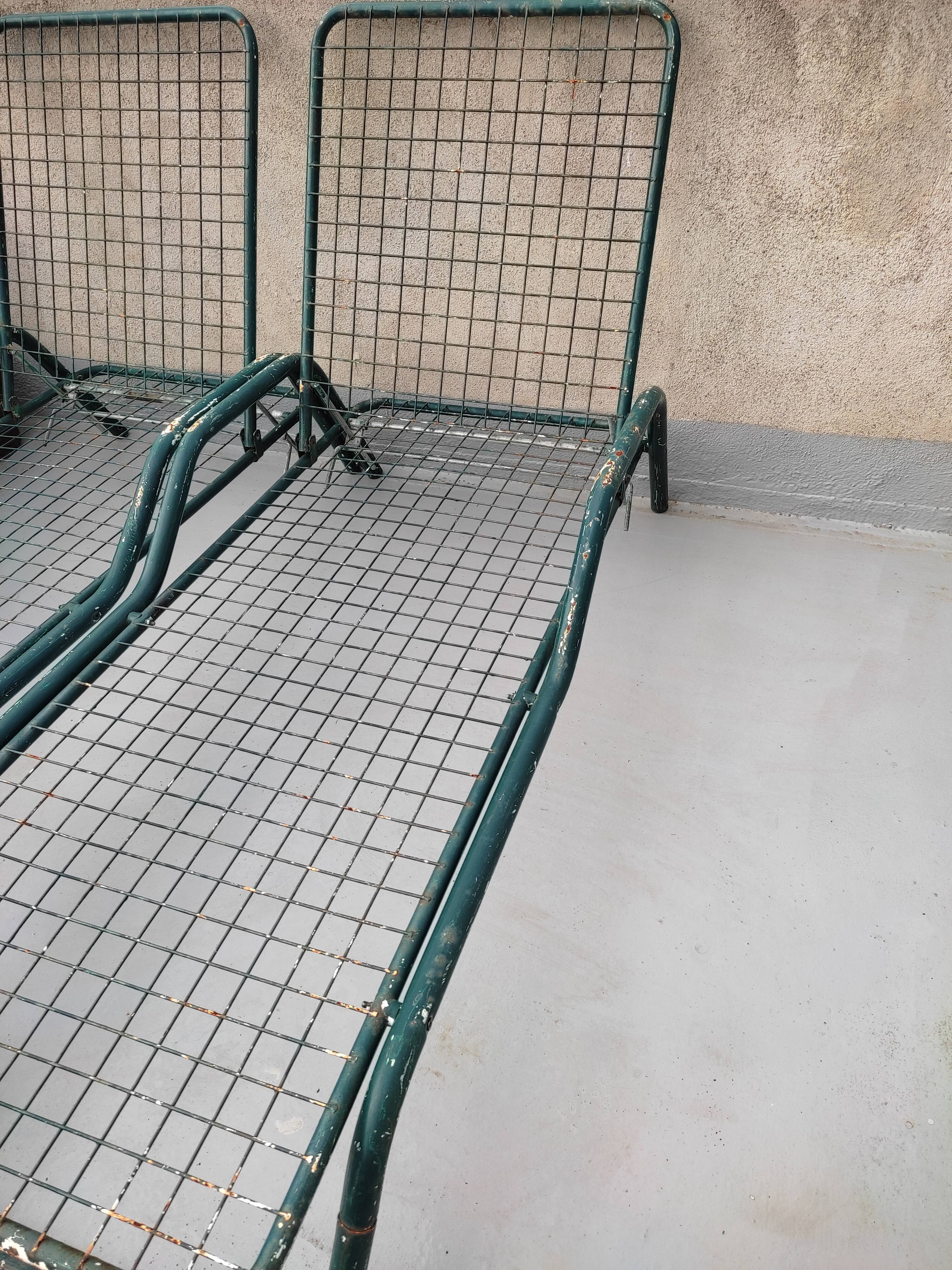 Pair of metal deckchairs